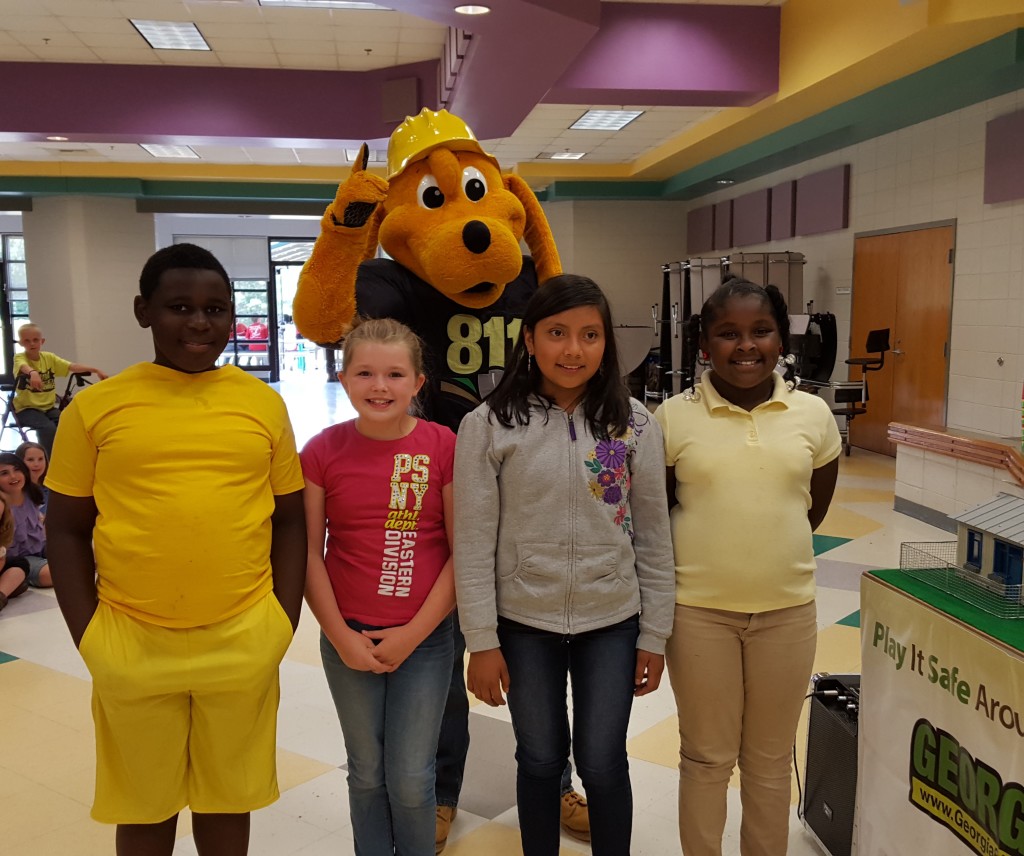 Digger with City of Monticello Utilities visits Washington Park